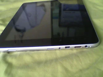 speaker, sd card slot, charger port, usb connection, hdmi (i think), audio port.webp